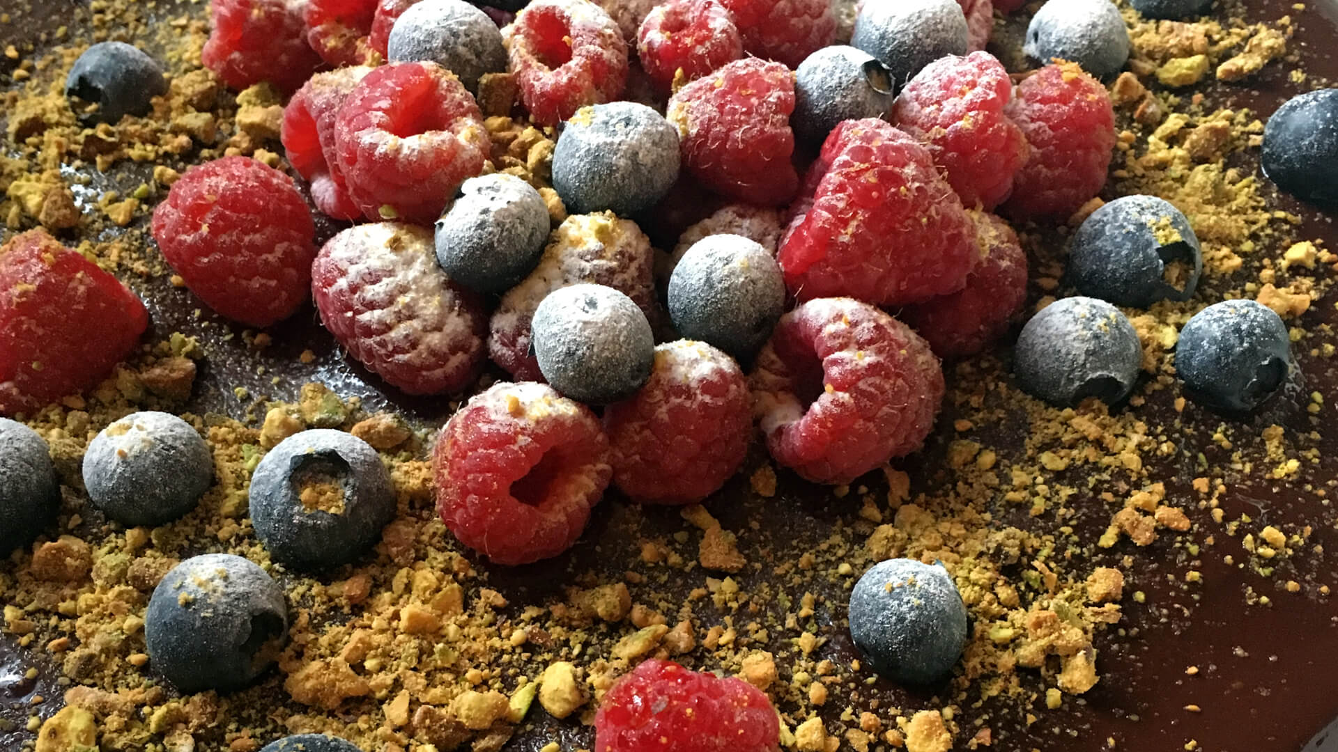 berries on drunken chocolate cake